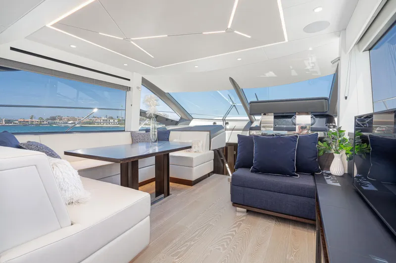 Slide: The Image of Luxurious interior of 2021 Sunseeker Manhattan 55 yacht with modern seating and panoramic windows. - 14