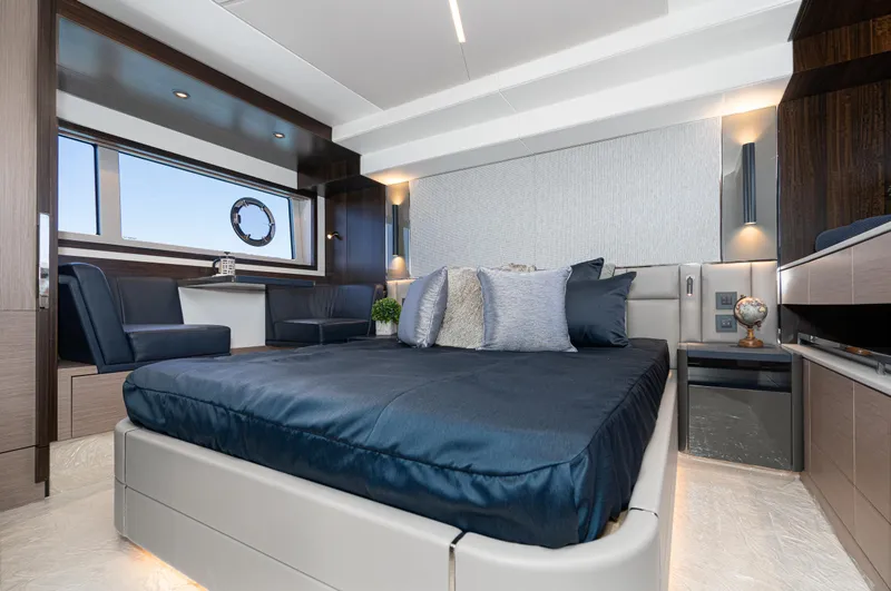Slide: The Image of Luxurious bedroom interior of 2021 Sunseeker Manhattan 55 yacht with modern furnishings. - 18