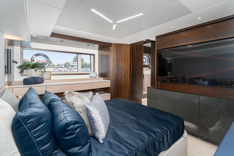 Slide: The Image of Luxurious bedroom interior of 2021 Sunseeker Manhattan 55 yacht with modern decor and large window. - 19
