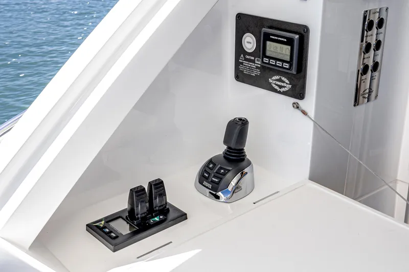 Slide: The Image of Control panel of a 2021 Sunseeker Manhattan 55 yacht with throttle and joystick. - 25