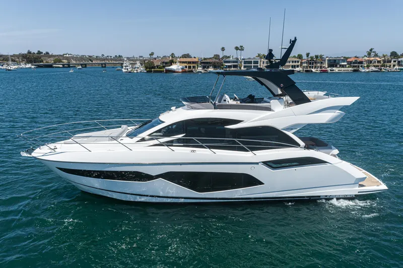 Slide: The Image of 2021 Sunseeker Manhattan 55 yacht cruising on a sunny day. - 32