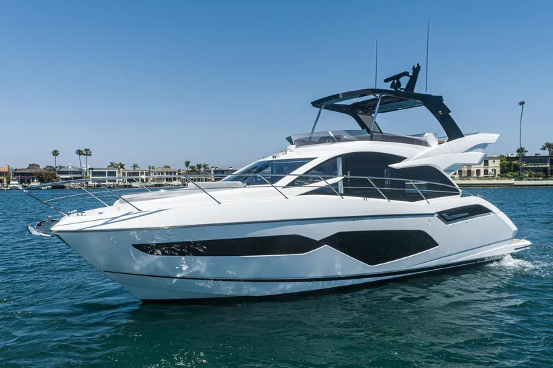 Slide: The Image of 2021 Sunseeker Manhattan 55 yacht cruising on a sunny day. - 35