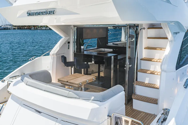 Slide: The Image of 2021 Sunseeker Manhattan 55 yacht with luxurious interior and exterior seating. - 5