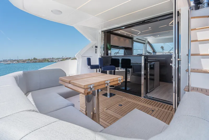 Slide: The Image of Luxury Sunseeker Manhattan 55 yacht interior, 2021 model, featuring modern seating and dining area. - 6