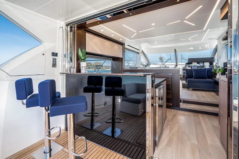 Slide: The Image of Luxurious interior of 2021 Sunseeker Manhattan 55 yacht with modern seating and bar area. - 8