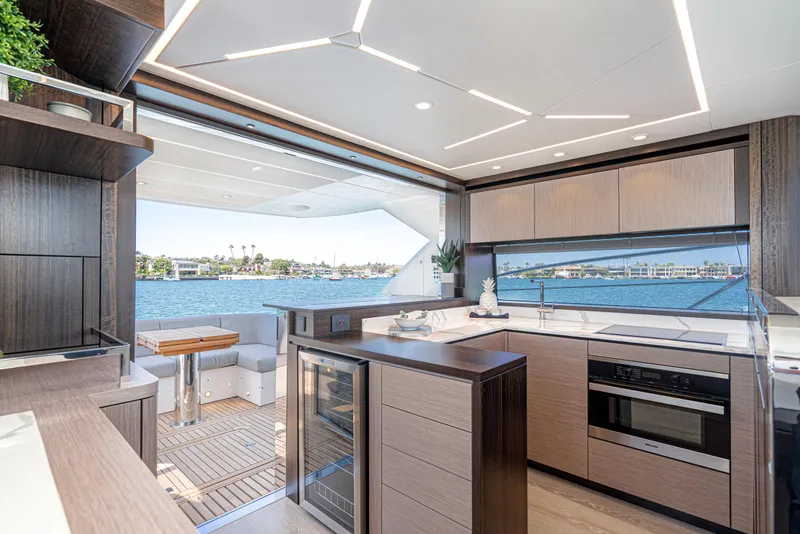 Slide: The Image of Modern kitchen and dining area on a 2021 Sunseeker Manhattan 55 yacht with ocean view. - 9