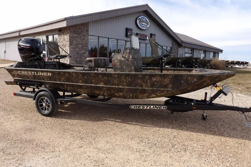 The Image of 2026 Crestliner 1870 Retriever FCC boat on trailer outside dealership. - 1