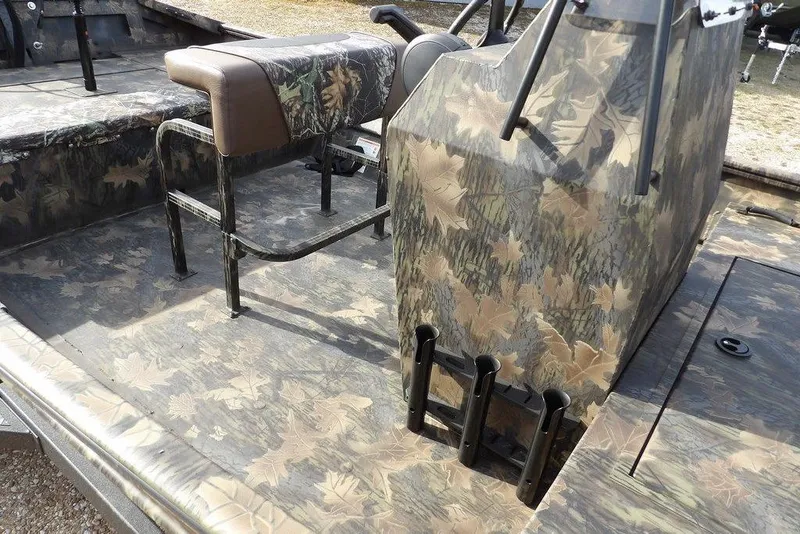 Slide: The Image of 2026 Crestliner 1870 Retriever FCC boat interior with camouflage design and seating. - 12