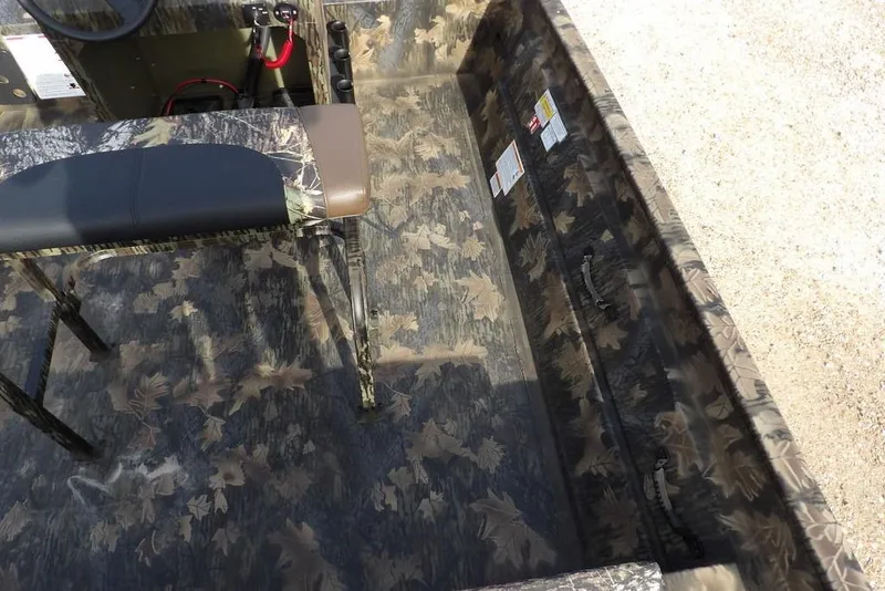 Slide: The Image of 2026 Crestliner 1870 Retriever FCC interior with camouflage pattern and seating. - 17