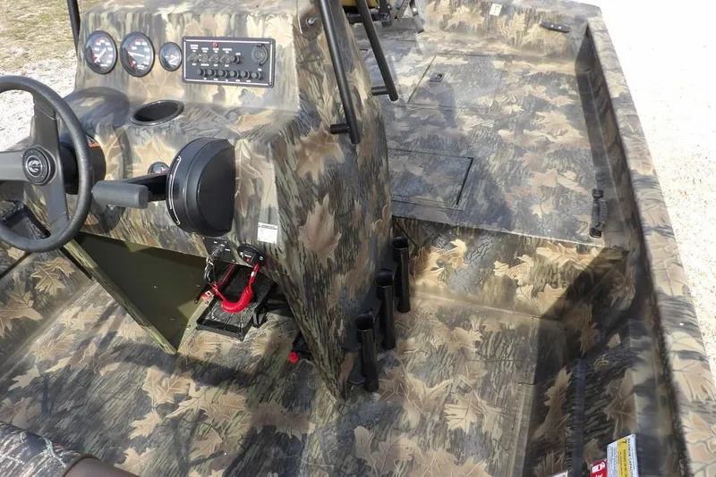 Slide: The Image of 2026 Crestliner 1870 Retriever FCC boat interior with camouflage design and control panel. - 25