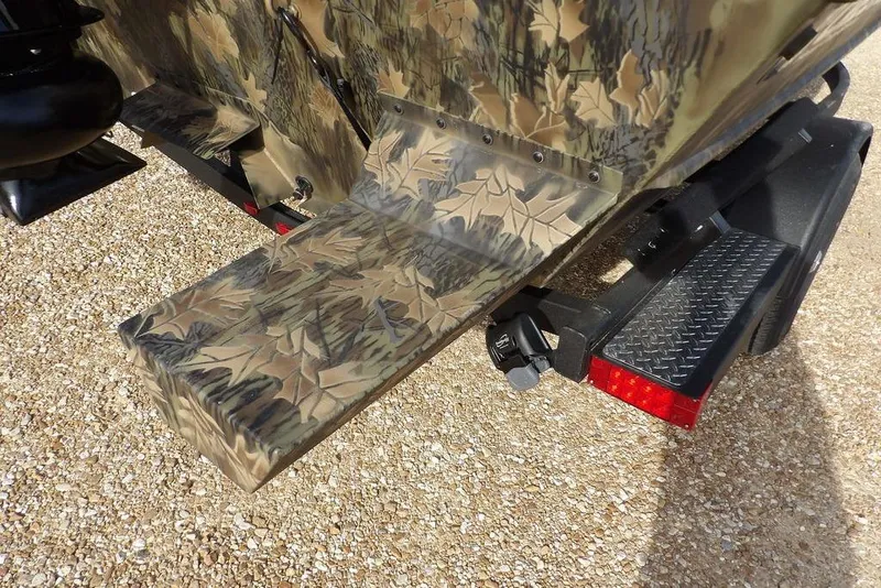 Slide: The Image of 2026 Crestliner 1870 Retriever FCC boat with camouflage design on a trailer. - 33