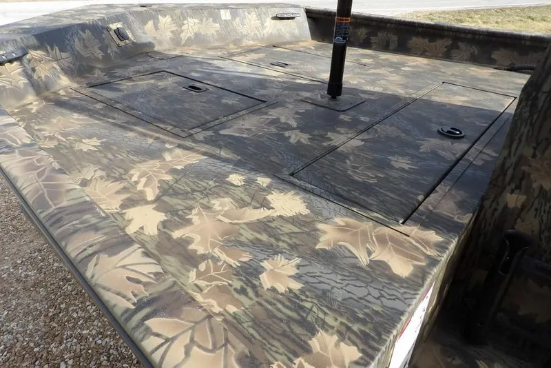 Slide: The Image of 2026 Crestliner 1870 Retriever FCC boat with camouflage leaf pattern deck. - 8