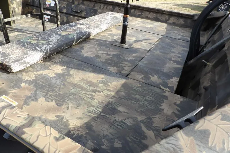 Slide: The Image of 2026 Crestliner 1870 Retriever FCC boat interior with camouflage pattern and seating. - 9