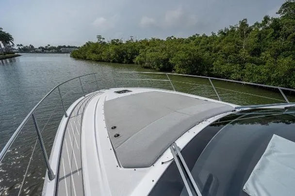 Slide: The Image of Azimut Atlantis 45 yacht cruising along a scenic river, 2022 model. - 12