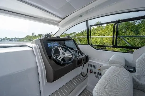 Slide: The Image of 2022 Azimut Atlantis 45 yacht cockpit with modern steering and navigation system. - 16