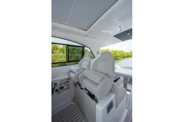 Slide: The Image of Interior of 2022 Azimut Atlantis 45 yacht with plush seating and scenic window view. - 18