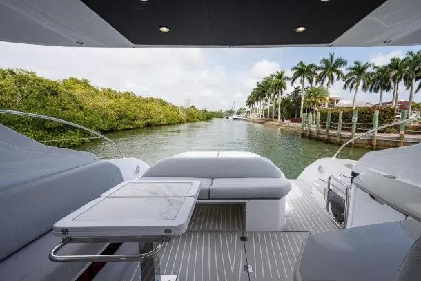 Slide: The Image of Azimut Atlantis 45 yacht, 2022 model, with luxurious deck overlooking a scenic waterway. - 19