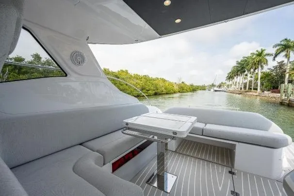 Slide: The Image of Luxurious Azimut Atlantis 45 yacht interior, 2022 model, featuring elegant seating and scenic waterway view. - 21