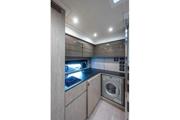 Slide: The Image of Modern kitchen interior of 2022 Azimut Atlantis 45 yacht with sleek cabinetry and appliances. - 28