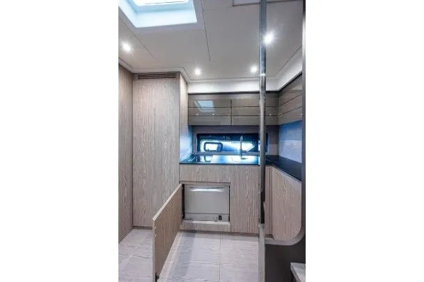 Slide: The Image of Interior of 2022 Azimut Atlantis 45 yacht, featuring modern design and sleek cabinetry. - 29