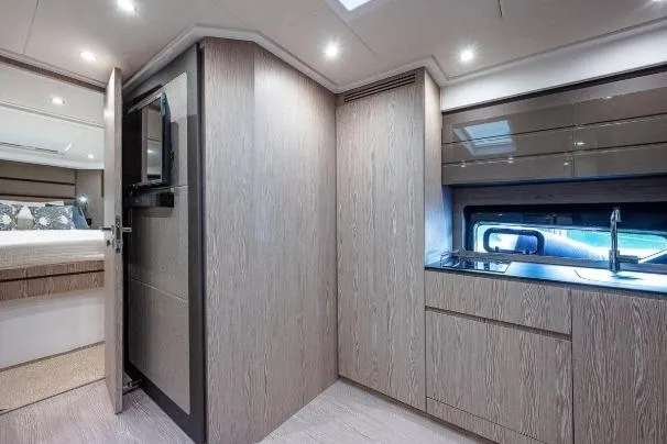 Slide: The Image of Modern interior of 2022 Azimut Atlantis 45 yacht, featuring sleek kitchen and cozy bedroom. - 31