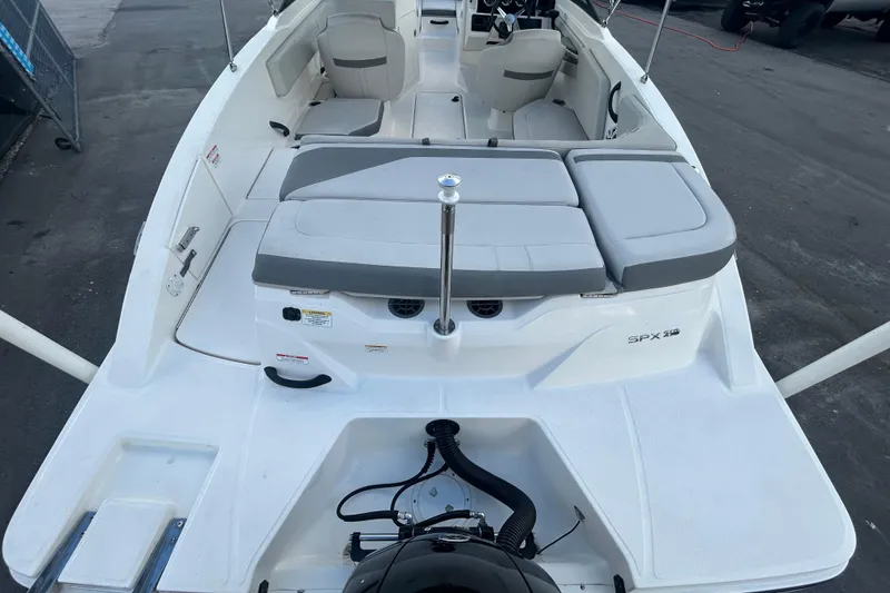 Slide: The Image of 2020 Sea Ray SPX 210 Outboard boat interior with seating and steering wheel. - 12
