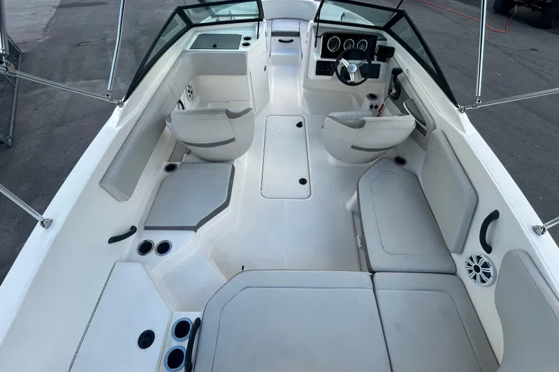 Slide: The Image of 2020 Sea Ray SPX 210 Outboard boat interior with seating and steering console. - 17