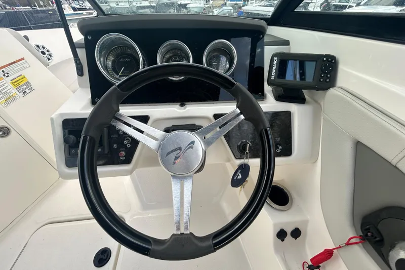 Slide: The Image of Steering wheel and dashboard of 2020 Sea Ray SPX 210 Outboard boat. - 22