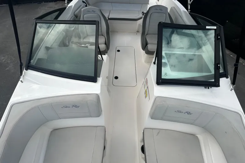 Slide: The Image of 2020 Sea Ray SPX 210 Outboard boat interior with seating and windshield. - 28