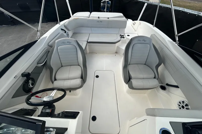 Slide: The Image of 2020 Sea Ray SPX 210 Outboard boat interior with gray seating and steering wheel. - 33