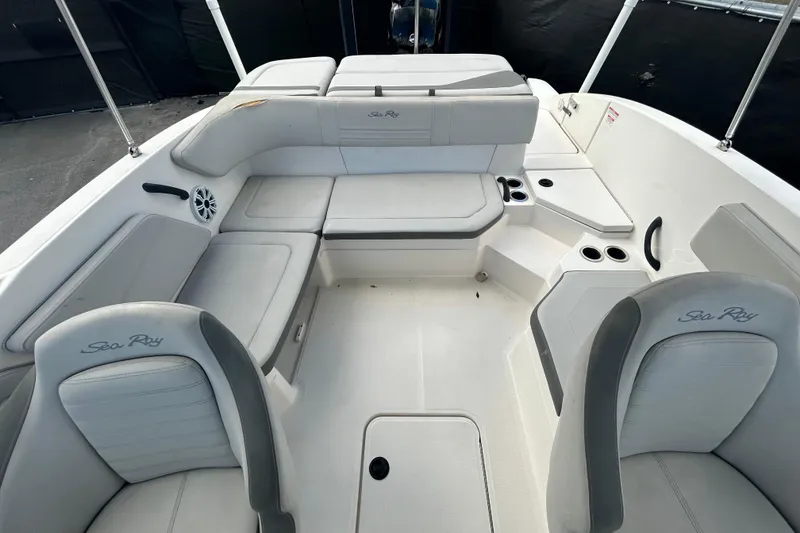 Slide: The Image of 2020 Sea Ray SPX 210 Outboard boat interior with spacious seating and cup holders. - 34
