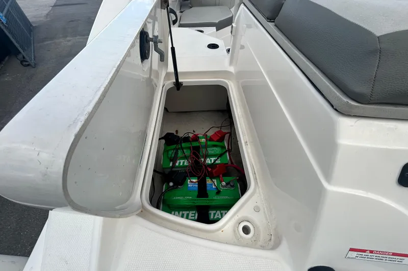 Slide: The Image of 2020 Sea Ray SPX 210 Outboard boat battery compartment with Interstate batteries. - 42