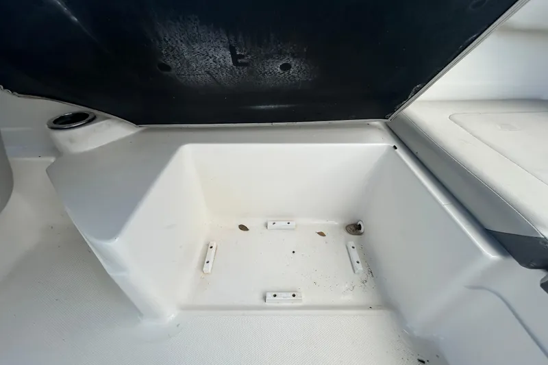 Slide: The Image of 2020 Sea Ray SPX 210 Outboard storage compartment, open and empty. - 46