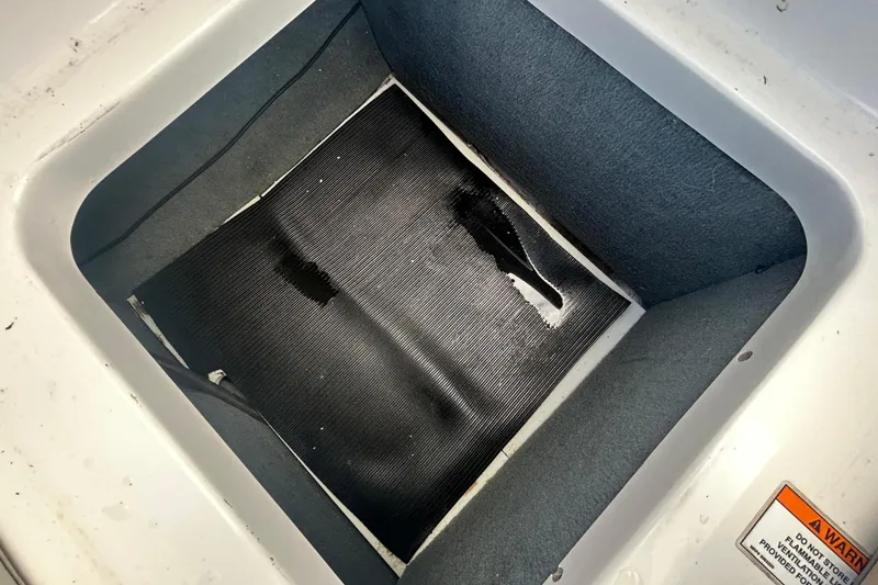 Slide: The Image of Storage compartment of 2020 Sea Ray SPX 210 Outboard boat, showing interior details. - 50