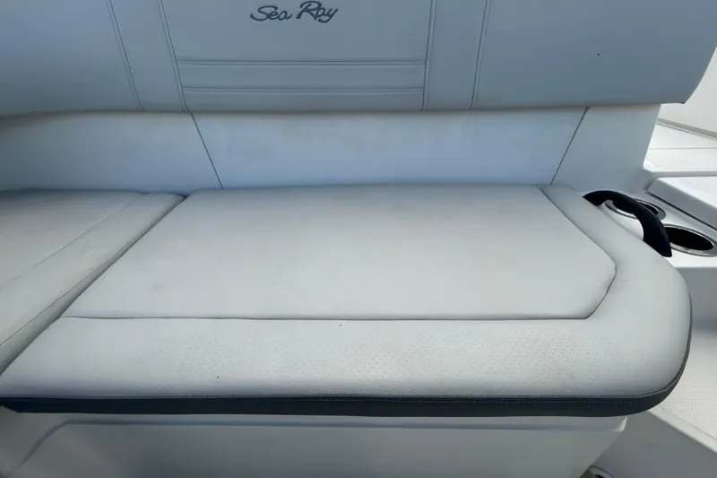 Slide: The Image of 2020 Sea Ray SPX 210 Outboard boat seat with white upholstery and cup holder. - 51