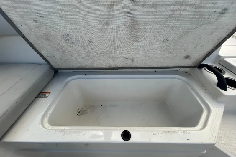 Slide: The Image of Open storage compartment on 2020 Sea Ray SPX 210 Outboard boat. - 52