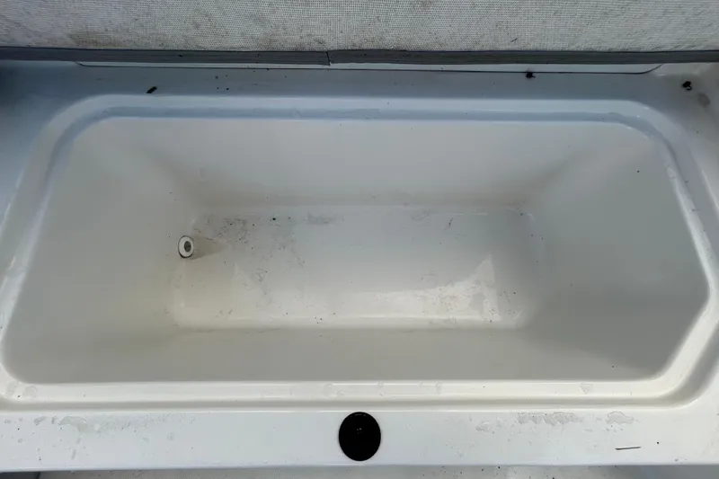 Slide: The Image of 2020 Sea Ray SPX 210 Outboard storage compartment, empty and clean. - 53