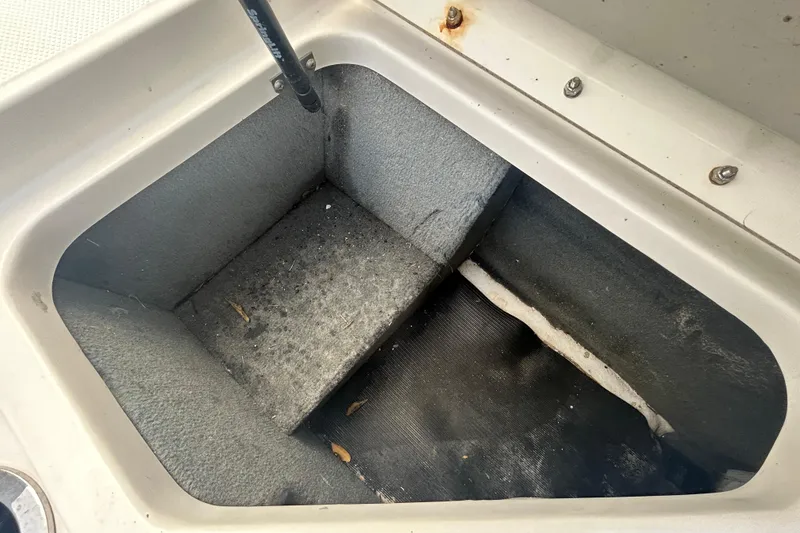 Slide: The Image of Storage compartment of 2020 Sea Ray SPX 210 Outboard boat, showing interior details. - 56
