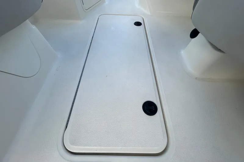 Slide: The Image of 2020 Sea Ray SPX 210 Outboard boat interior floor with storage compartment. - 63