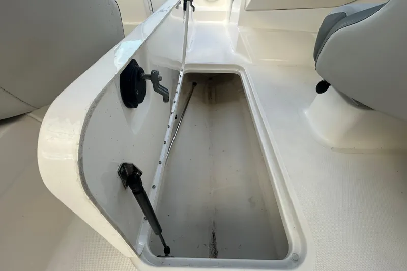 Slide: The Image of 2020 Sea Ray SPX 210 Outboard boat storage compartment, open and empty. - 64