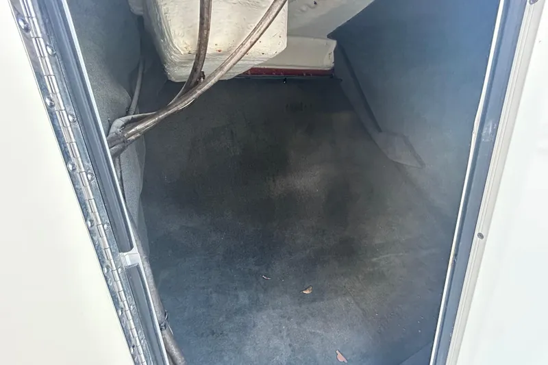 Slide: The Image of Storage compartment inside a 2020 Sea Ray SPX 210 Outboard boat. - 68