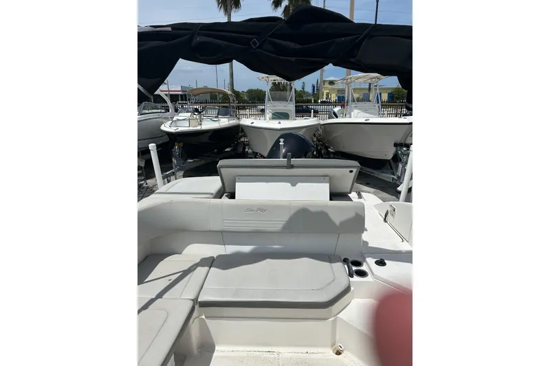 Slide: The Image of 2020 Sea Ray SPX 210 Outboard boat with Mercury engine on trailer under blue sky. - 7