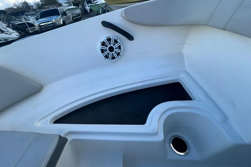 Slide: The Image of 2020 Sea Ray SPX 210 Outboard interior with speaker and storage compartment. - 70