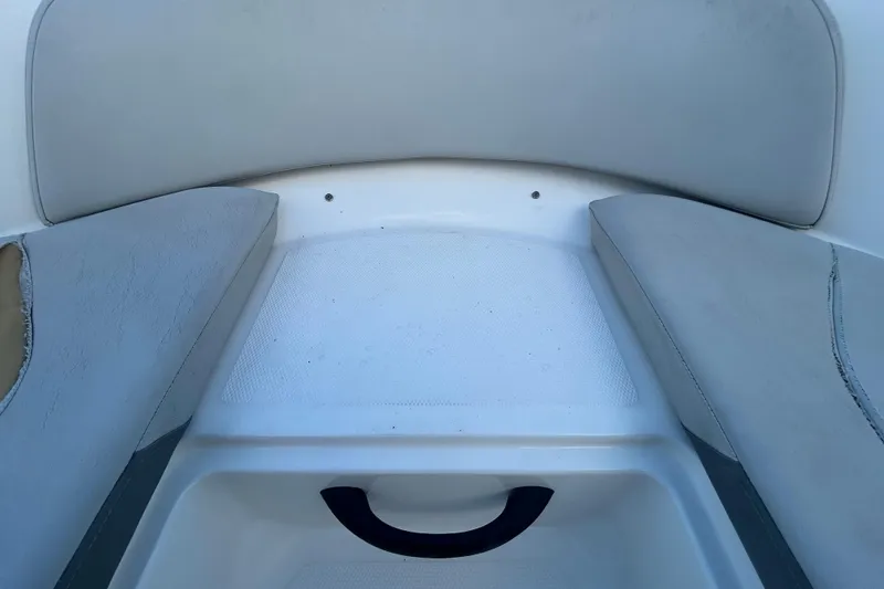 Slide: The Image of Interior seating of 2020 Sea Ray SPX 210 Outboard boat, featuring cushioned seats. - 73