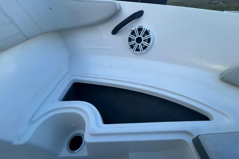 Slide: The Image of 2020 Sea Ray SPX 210 Outboard boat interior with speaker and storage compartment. - 75