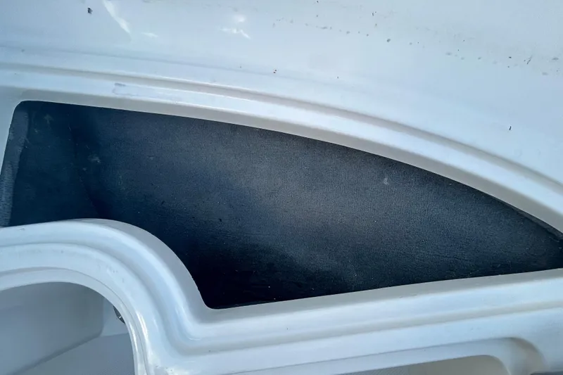 Slide: The Image of 2020 Sea Ray SPX 210 Outboard interior detail, featuring white and black design elements. - 76