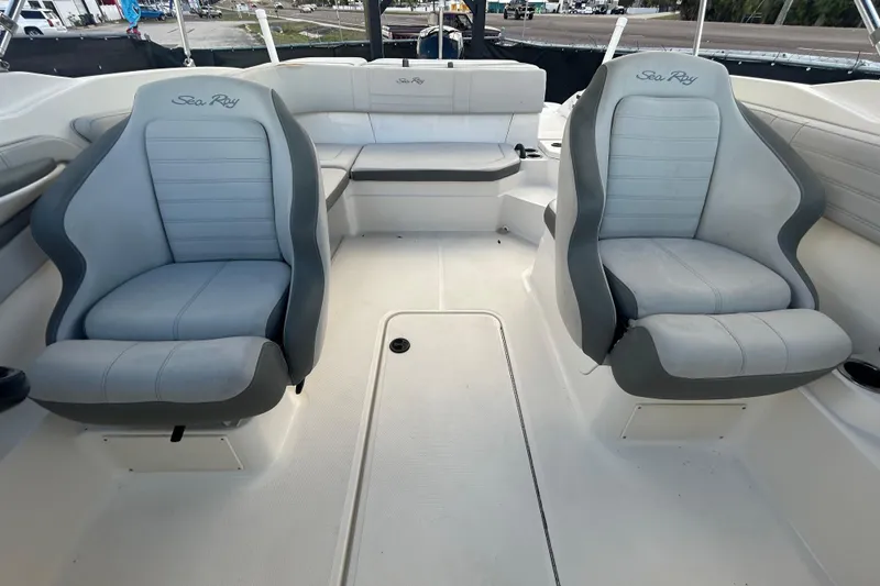 Slide: The Image of 2020 Sea Ray SPX 210 Outboard interior with two gray seats and spacious layout. - 77