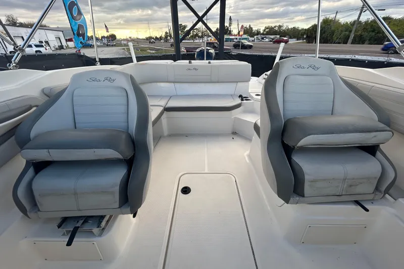 Slide: The Image of 2020 Sea Ray SPX 210 Outboard boat interior with gray seating and open deck. - 78