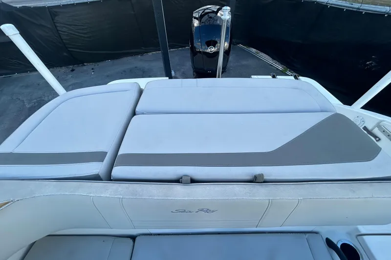 Slide: The Image of 2020 Sea Ray SPX 210 Outboard boat with cushioned seating and sleek design. - 79