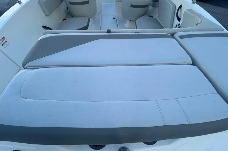 Slide: The Image of 2020 Sea Ray SPX 210 Outboard boat interior with cushioned seating. - 83